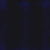 Distressed texture with mottled indigo and black, speckled with saturated blue; matte, granular surface creating an abstract, somber composition.